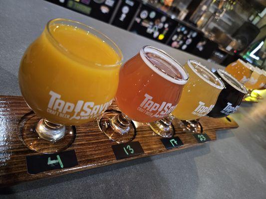 Flight of varying beers. The blood orange was nice.