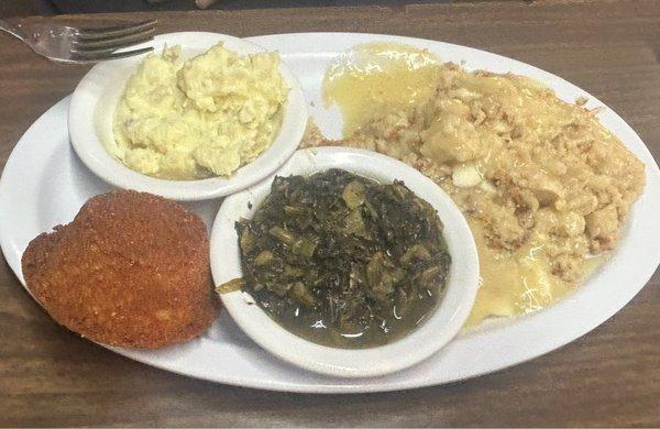 The patrons food! Chicken & dressing, turnip greens, potato salad & a cornbread muffin.