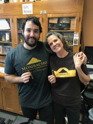 Owner - Jonnette Kraft with Manager - Lewis Antolik supporting & smoking a  Mombacho Cigar & enjoying our jobs.