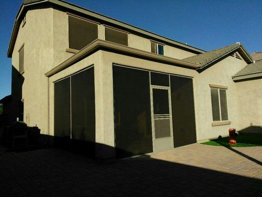 This is a Screen Room installed under an existing patio cover.