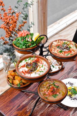 Variety of spreads: hummus, Baba ghanouj, labneh