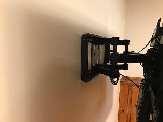 AFTER INSTALL: The tv mount was perfectly and neatly secured to the wall...