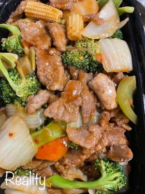 Szechuan beef. Tastes a lot like beef with mixed vegetables, though. I never would have ordered this. I hate mushrooms and anemic beef.