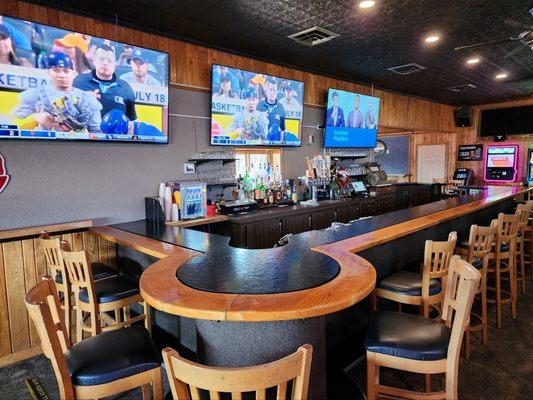 indoor bar seating and televisions