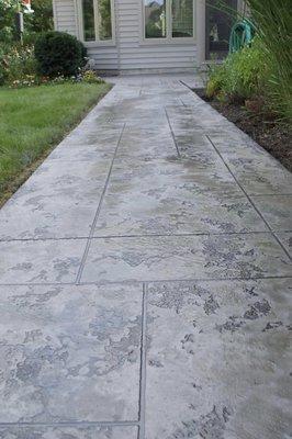 Elevate your outdoor spaces with Perfection Concrete Coatings' stamped concrete services...