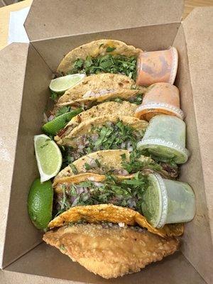 From top to bottom: Al Pastor Taco, carne asada, Birria Taco and Empanada