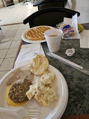 Hot breakfast items, banana,  Danish, and apple juice for part of my brunch