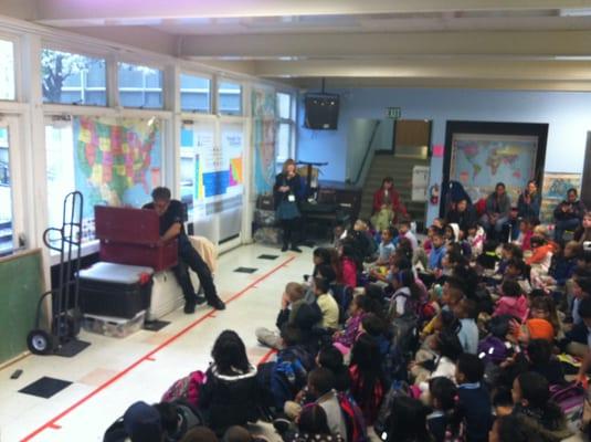 Assembly learning about Native American  Water Drumming