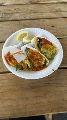 Asada tacos with everything (onion, cilantro, and guacamole) plus salsa