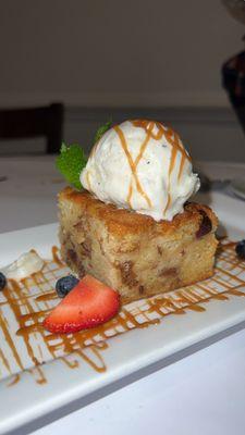 Bread pudding , topped with vanilla gelato & caramel drizzle