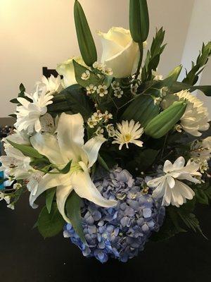 Beautiful in Blue arrangement. $84.13 ($12.95 delivery fee and tax included).