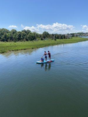 Three-person paddle board at Bass River Kayaks and Paddle Boards