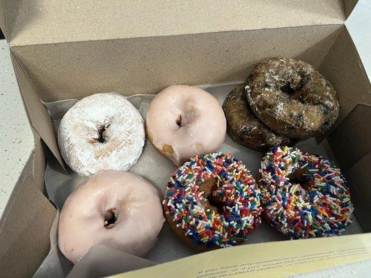 Powdered Sugar Cake Donut, Cherry Iced Cake Donut, Blueberry Cake Donut, Cherry Iced Cake Donuts with sprinkles