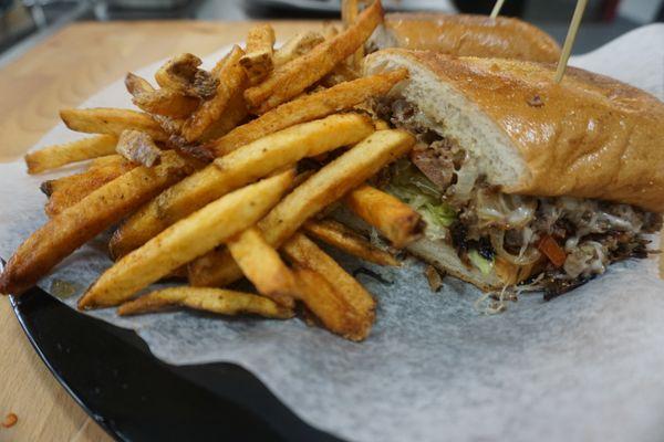 Delicious steak and cheese with house cut fries