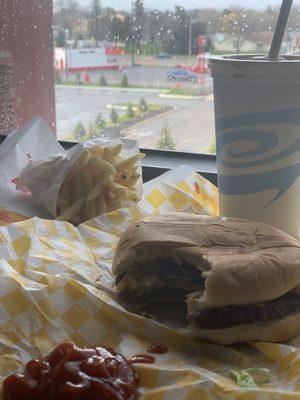 Jalapeño bacon cheeseburger, chocolate shake, fries and Burger time in the back ground.