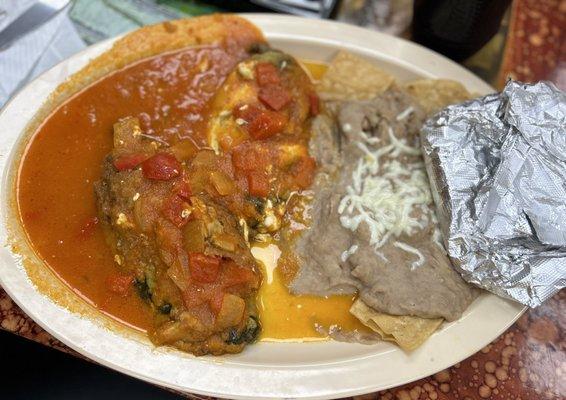 Chiles Rellenos (stuffed with cheese) with refried beans.