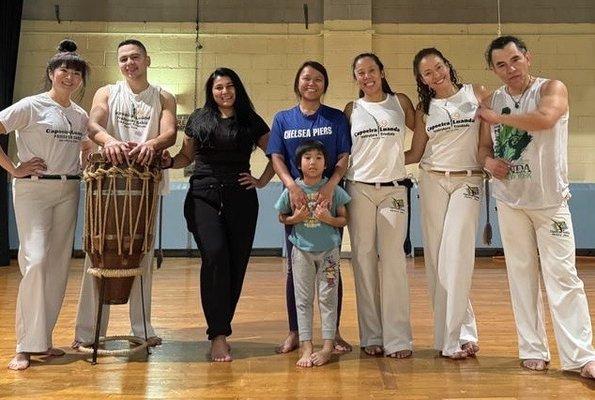 Capoeira students atabaque drum music muscles