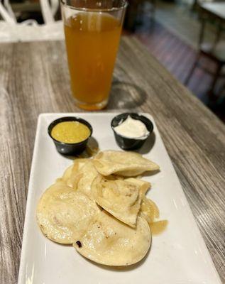 Traditional Potato Cheese Pierogies and Beer. Yinz need to try the pierogies with the mustard!