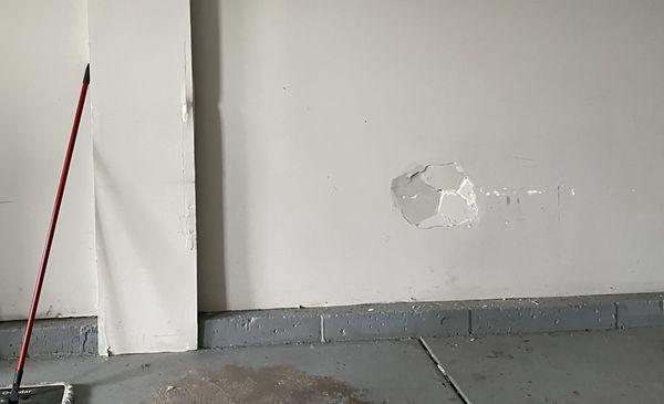 Garage wall damage before