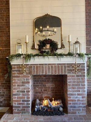 Lovely fireplace in the entrance.