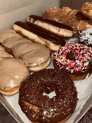 Maple, Cake donuts w/sprinkles & w/ coconut, bear claw and cinnamon role.