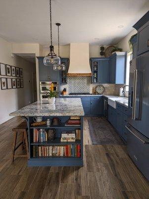 Custom Sherwin Williams paint color Slate Tile for these beautiful kitchen cabinets and White Ice granite tops.