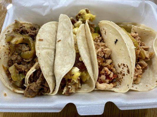 2 beef tacos, a breakfast taco, and 2 chicken tacos