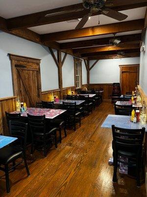 First floor dining room has tables painted by the employees!