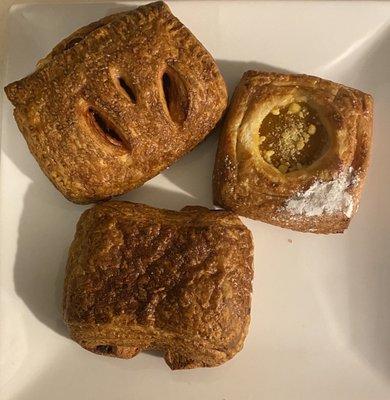 Bottom Chocolate croissant, cherry left upper, right upper apricot cream cheese.