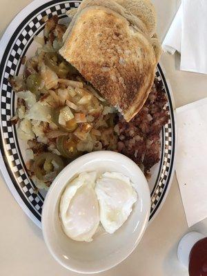 Corned beef hash, home fries with onions and jalapeños and poached eggs!   Yum!