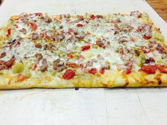 Specialty Pizza called the Gene's Original! Sausage, Artichokes, Red Roasted Peppers