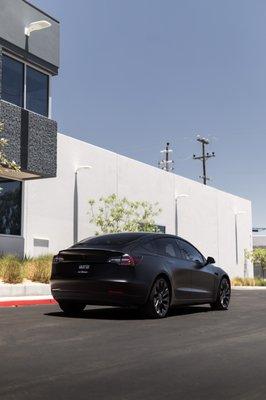 Tesla Model 3 came in for a Full wrap in satin black, PPF tint on the headlights and Vinyl ceramic coating.