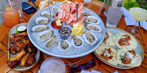 Freshly shucked oysters, giant shrimp, pork & fish tacos, chicken wings