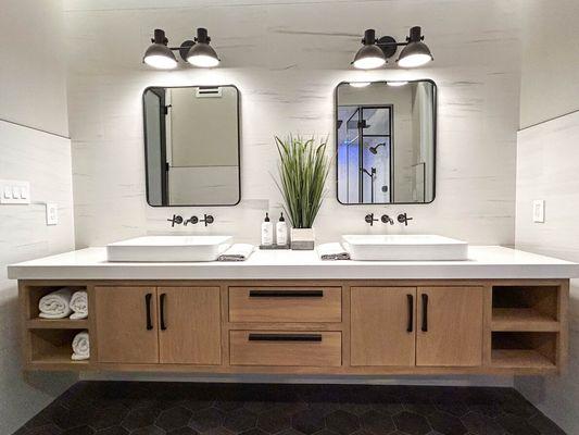 White quartz vanity top with mitered edge.