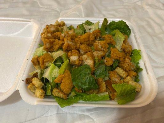 Caesar Salad with added chicken.... Came with three small containers of salad dressing