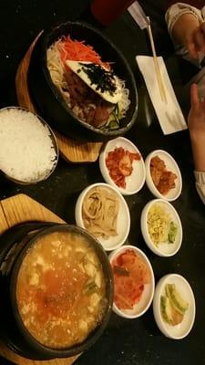 Stone pot binbambap at top, kimchi beef tofu soup at bottom (comes with rice), banchan in the middle