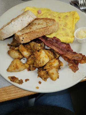 Ham & cheese omelet, homemade wheat toast, homefries and bacon