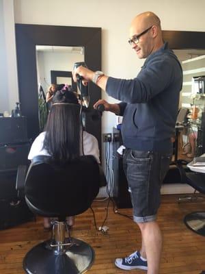 Marcelo doing a wonderful job with blow drying his clients hair.