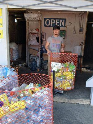 This is Kevin assisting my husband & I with all our recycled items.