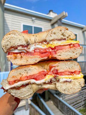 Bacon, egg, cheese, tomato on rosemary olive oil bagel