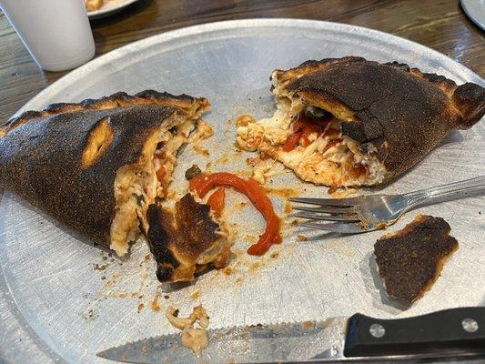 VERY burnt 3 ingredient calzone- sausage, black olives & red pepper that was supposed to be red onion.