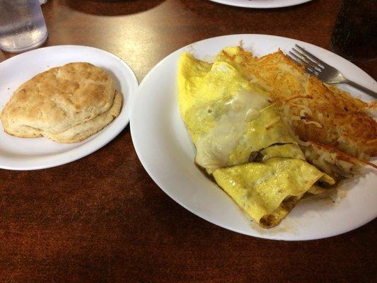 Philly cheesesteak omelette with hash browns and a biscuit.