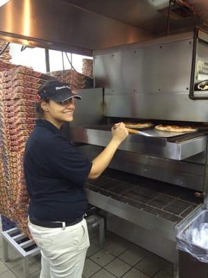 Summer working the oven.