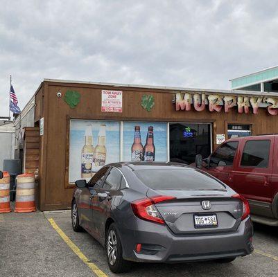 The Trump flag under the American flag might explain the lack of mask wearing in this establishment.