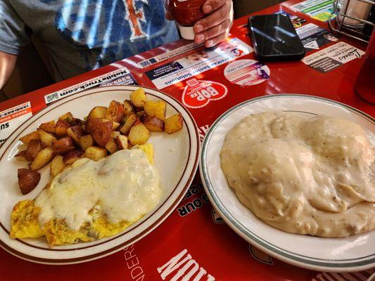 Senior bacon and mushroom omelet with potatoes and biscuits & gravy