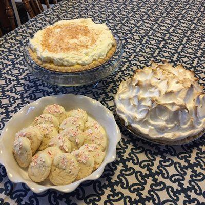 Coconut creme and lemon merengue pies! Cookies are homemade and NOT from Gene's but were part of our holiday spread!