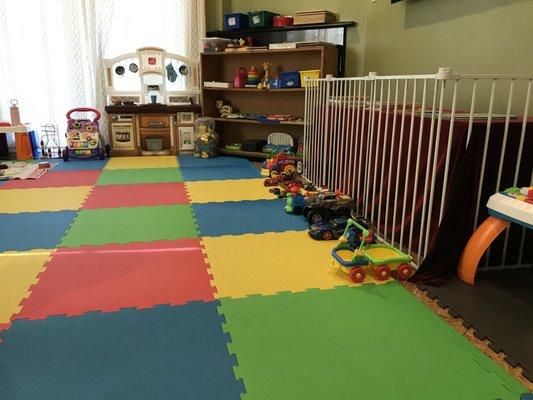 We have a large, safe, and fun play area inside with a variety of toys to play with.