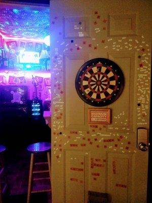 Magnetic dart board and magnetic poetry at the Outhouse