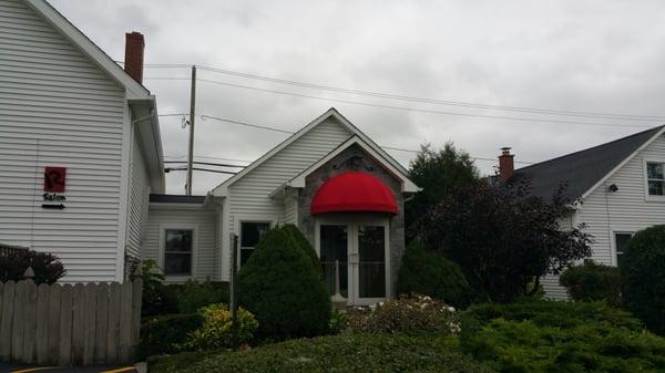 Back Entrance to R Salon located on  Transit, also with an entrance on McKinley off of Main Street.