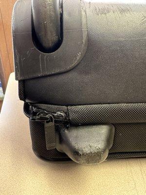 Side view where they used a super glue on a Tumi bag.